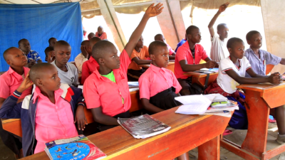 PUPILS IN TENT LEARNING